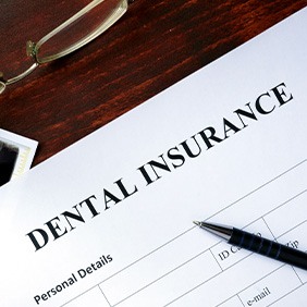 Dental insurance form on table