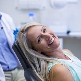 Laughing, happy patient in treatment chair